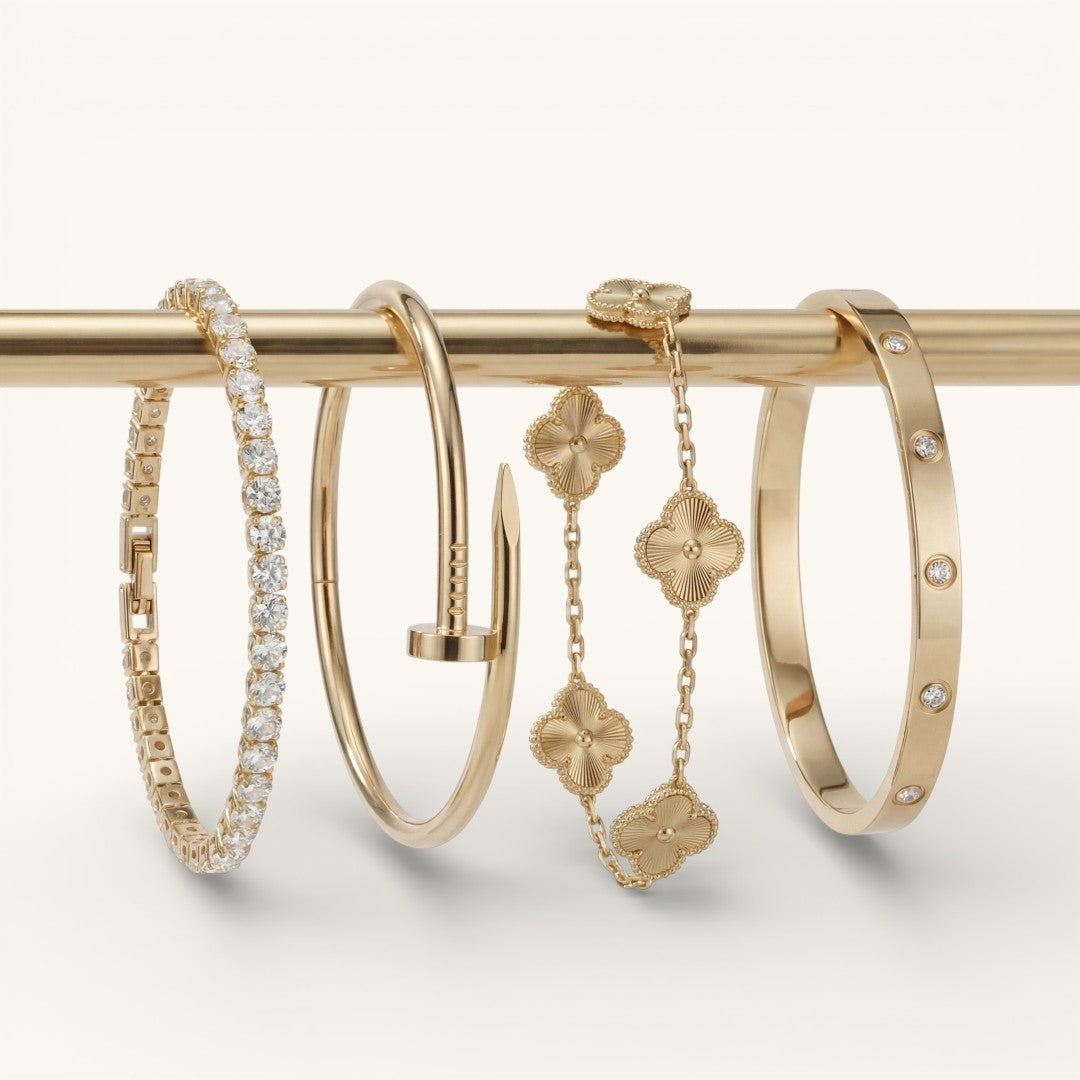 Gold PVD coated bracelet stack worn on a wrist