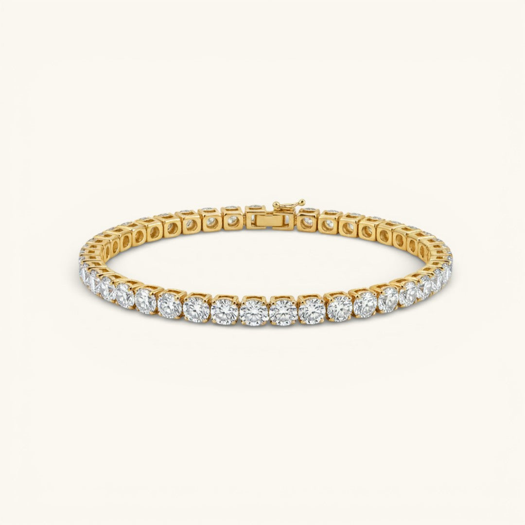 VM Tennis Bracelet Gold, a full line of cubic zirconia stones on an 18k gold PVD bonded surgical steel setting
